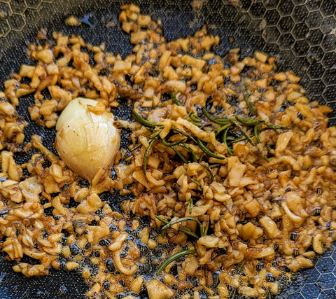 Cooked morel stems, garlic and rosemary