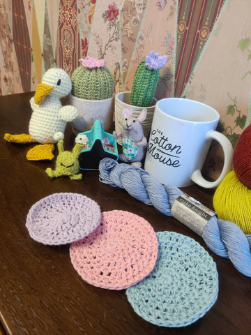 crochet makeup wipe with some crochet animals behind