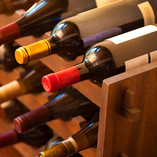 A wooden wine rack filled with bottles