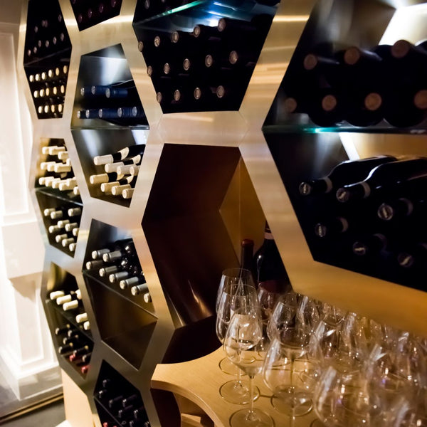 A hexagonal shaped wine rack with horizontal bottle storage