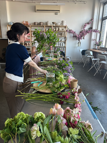 Molly Oliver Flowers sustainable floral design studio workshop sunset park hands on seaosnal flowers local flowers eco friendly techniques floral design 101 basics ranunculus hellebore viburnum butterfly ranunculus lilac lazy susans view of Manhattan skyline