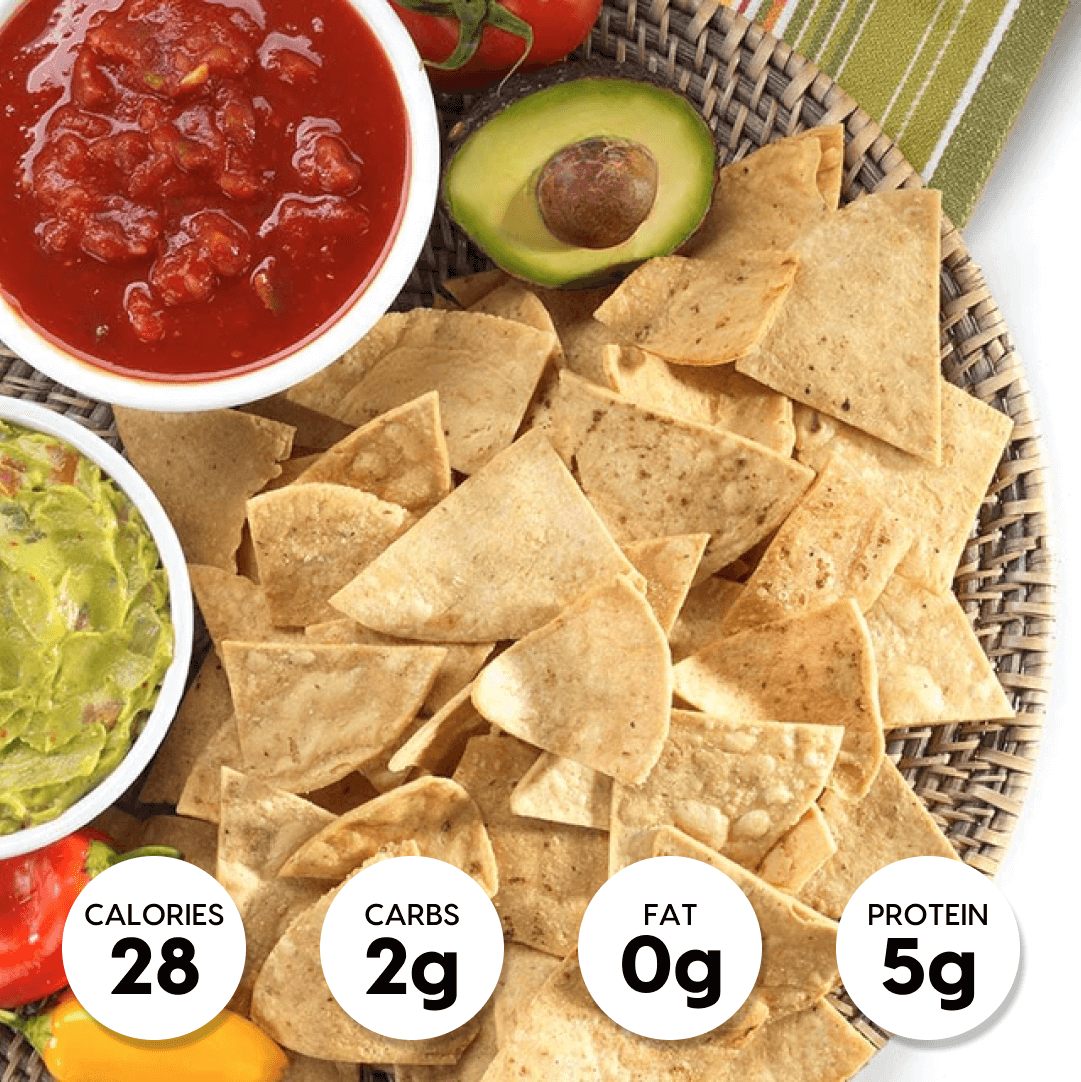 A bowl of chips with salsa, guacamole, and other ingredients, perfect for managing cravings and making healthy meal and snack choices
