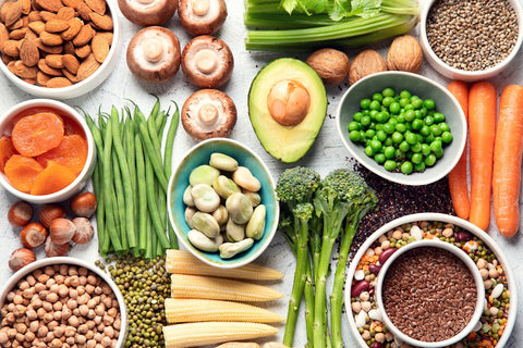 A selection of foods such as nuts, beans, and vegetables, with a focus on hyperinsulinemia and insulin production