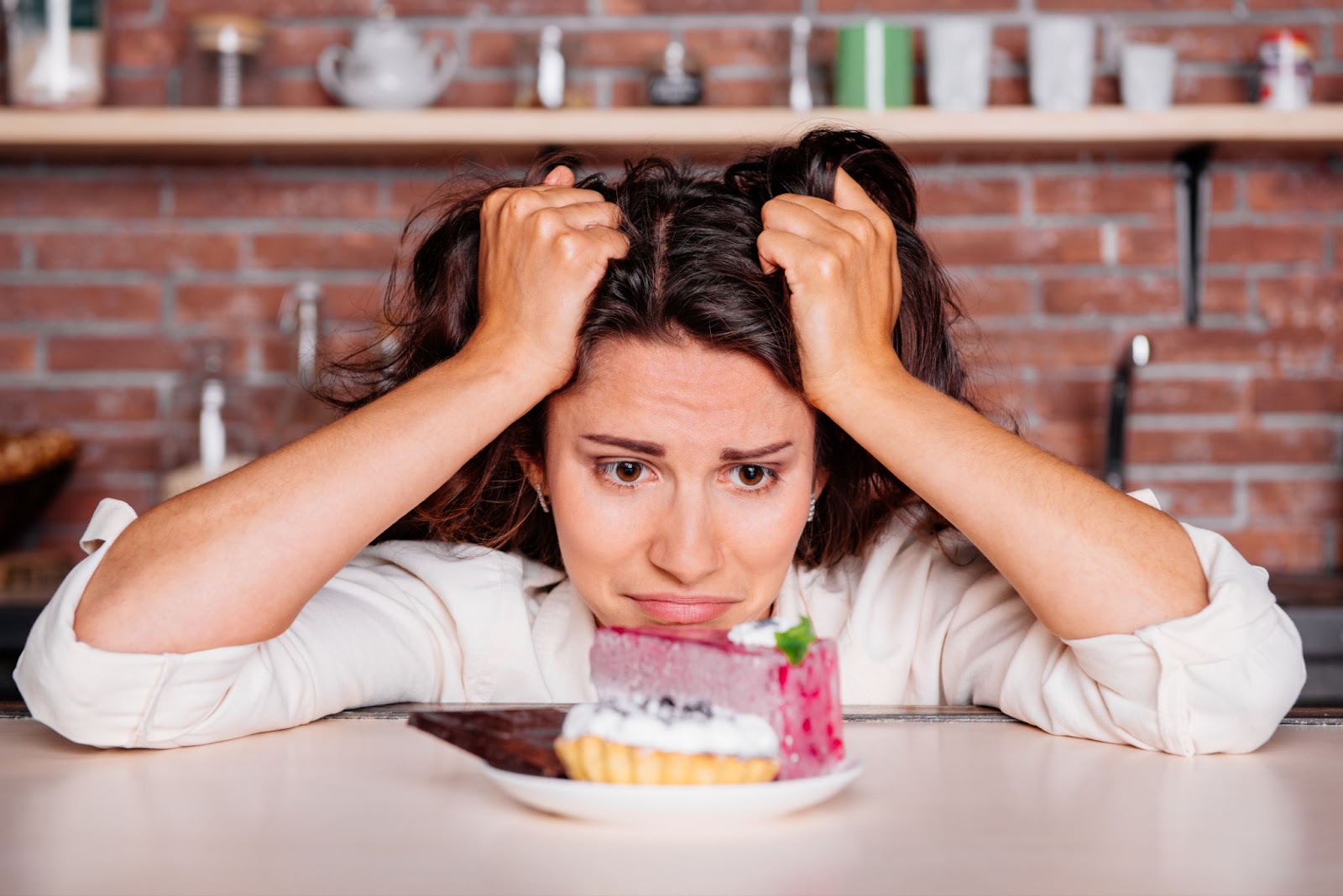 A woman indulges in a slice of cake while practicing mindful eating and choosing healthy meals and snacks