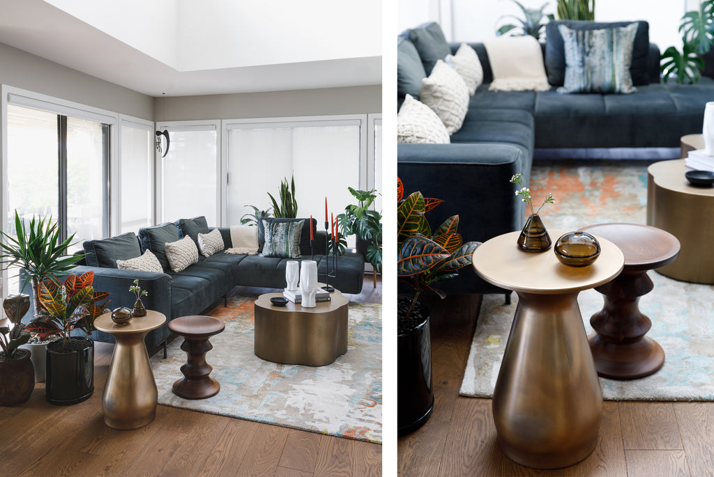 You'll never be lonely with this many plant friends around to relax with. Create a crowd in the living room with an array of indoor plants that create interest and drama. Dark foliage matches the dark wood, and brings the lighter-coloured furniture and accents into focus. 