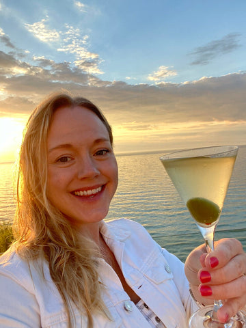 melissa holding an na martini at sunset