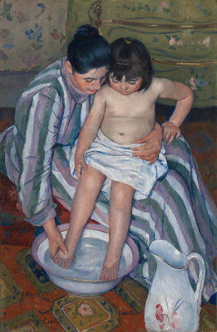 Child being bathed by mother