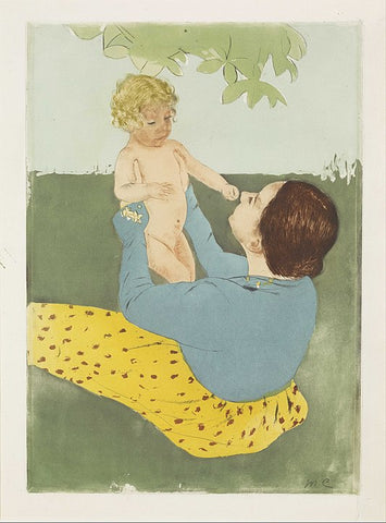 Mother holding small child and playing