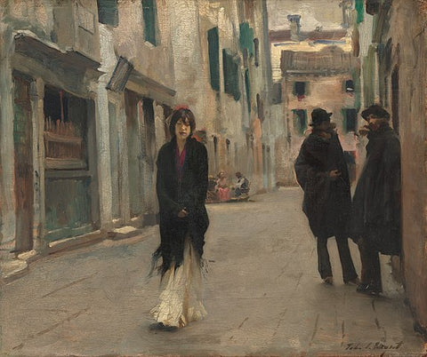 woman walking down a Venice street