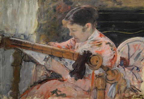 woman working at tapestry frame