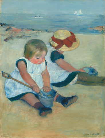 Two children playing at the beach