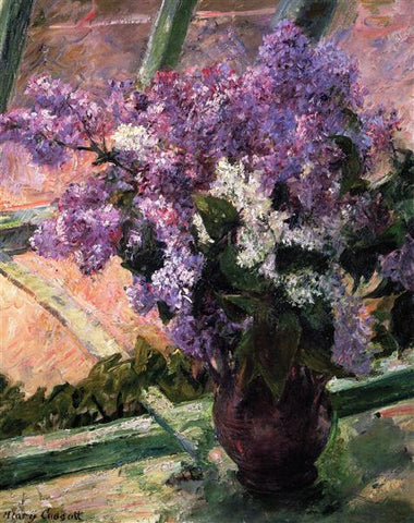Lilacs in a vase sitting in a windpw
