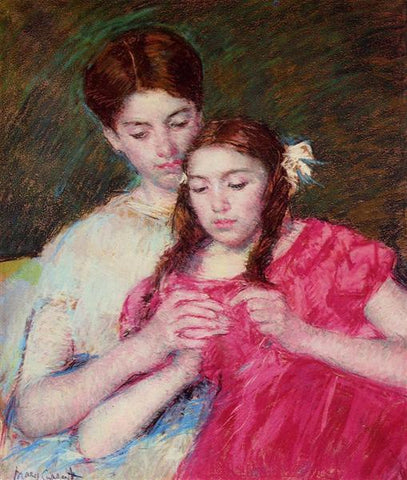 Mother giving daughter crochet lesson