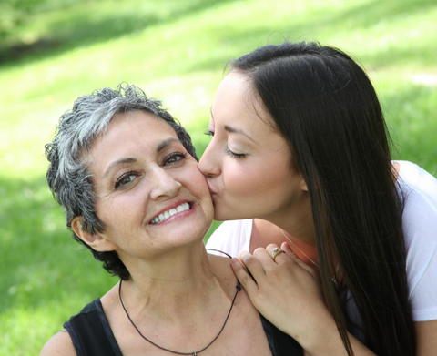 Laice kisses her smiling mother on the cheek