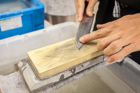 Sharpening kitchen knife with stone by Japanese style