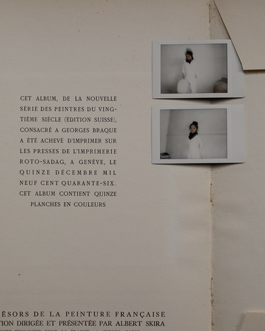 two polaroid pictures on text