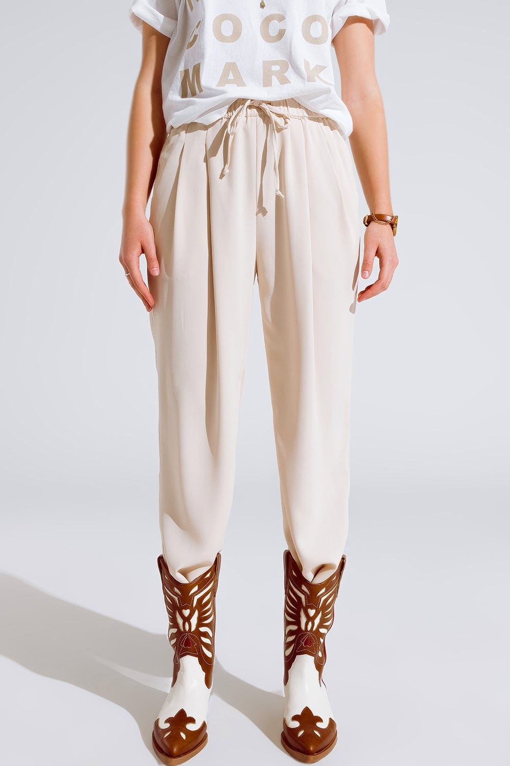 Pants In Beige With Front Pockets And Drawstring Closing