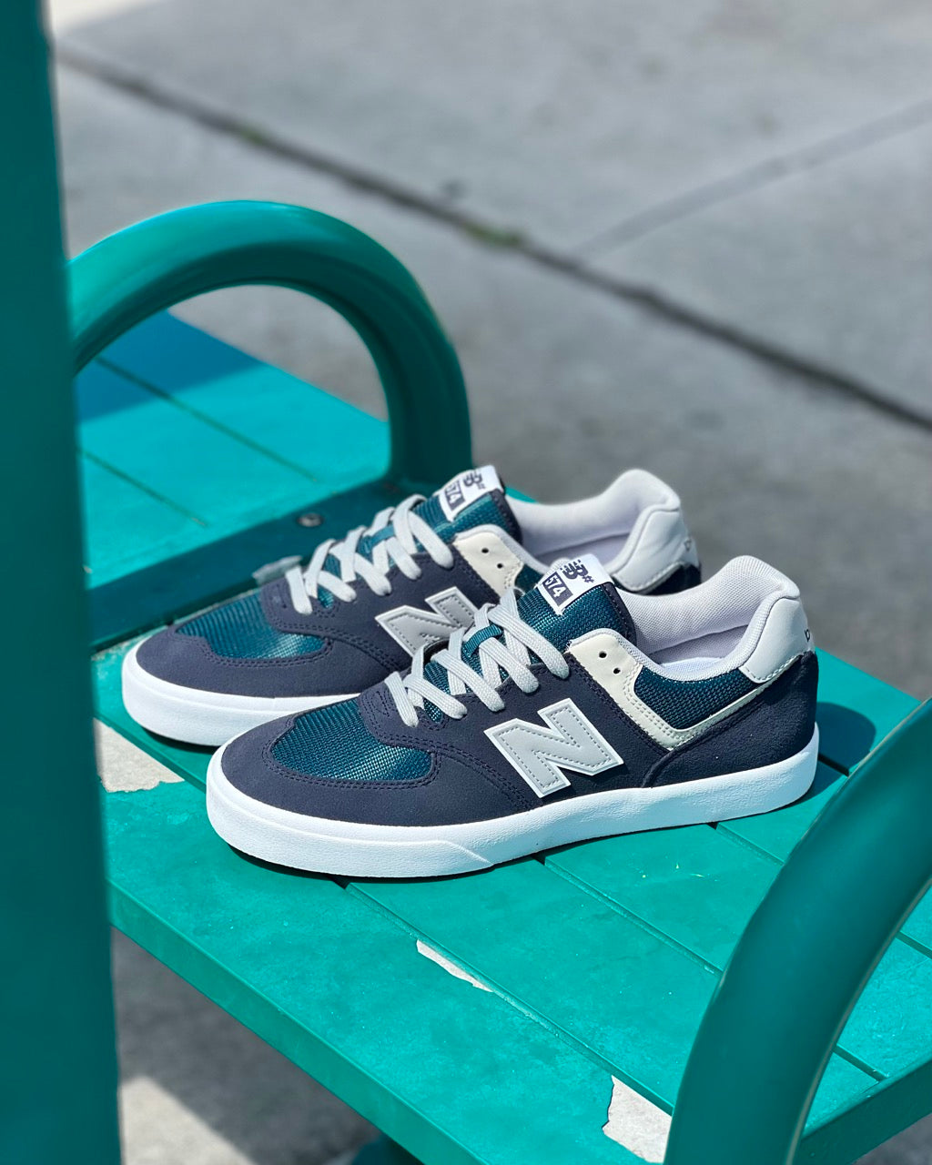 Image of a pair of New Balance Numeric 574 Vulc Skate Shoes inspired by the Classic New Balance 574 in Navy/Teal built for skateboarding