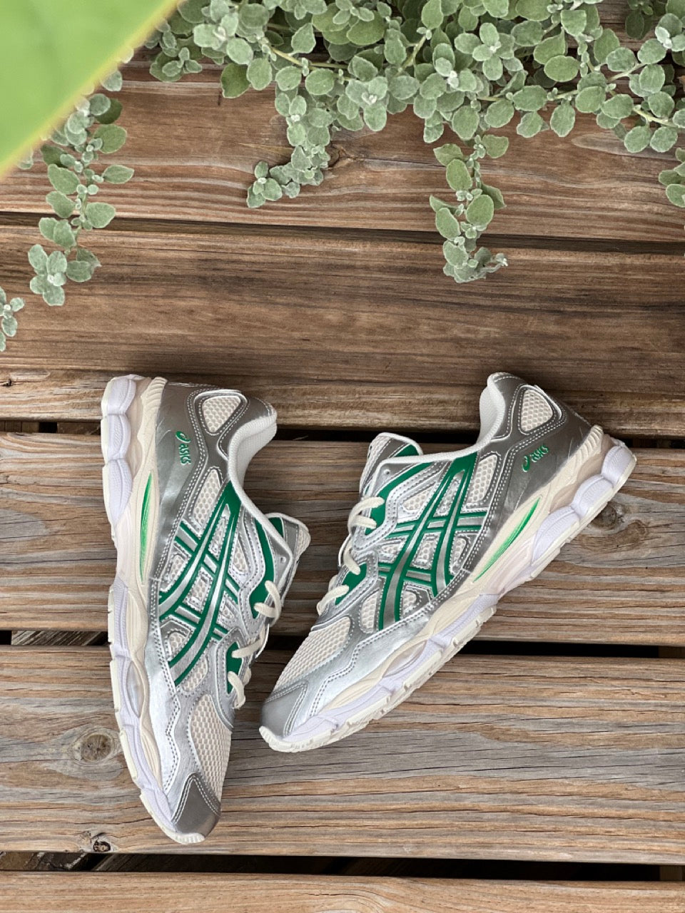 Image of the ASICS GEL-NYC Kale Pack in Birch Silver in a wooded green background