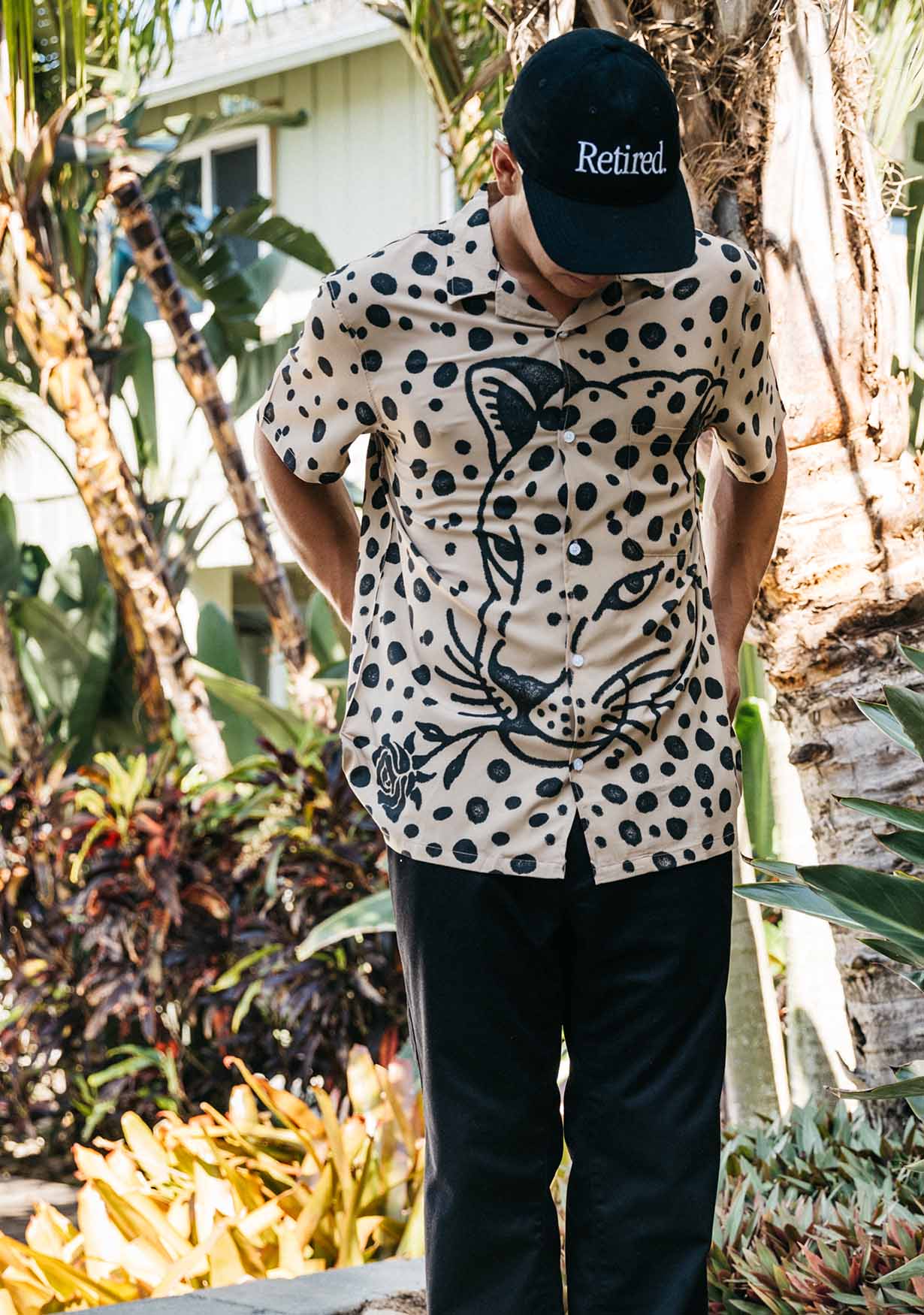 Man confidently sporting the vibrant Big Cat Button Up from Duvin, showcasing its unique design