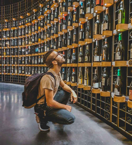 Man exploring a wide range of wines