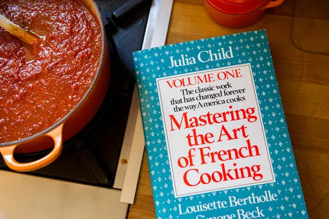 "Mastering the Art of French Cooking" by Julia Child, Louisette Bertholle, and Simone Beck