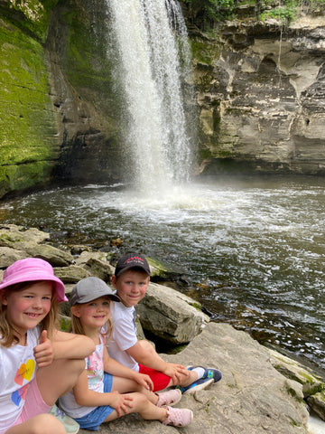 kids with a waterfall.