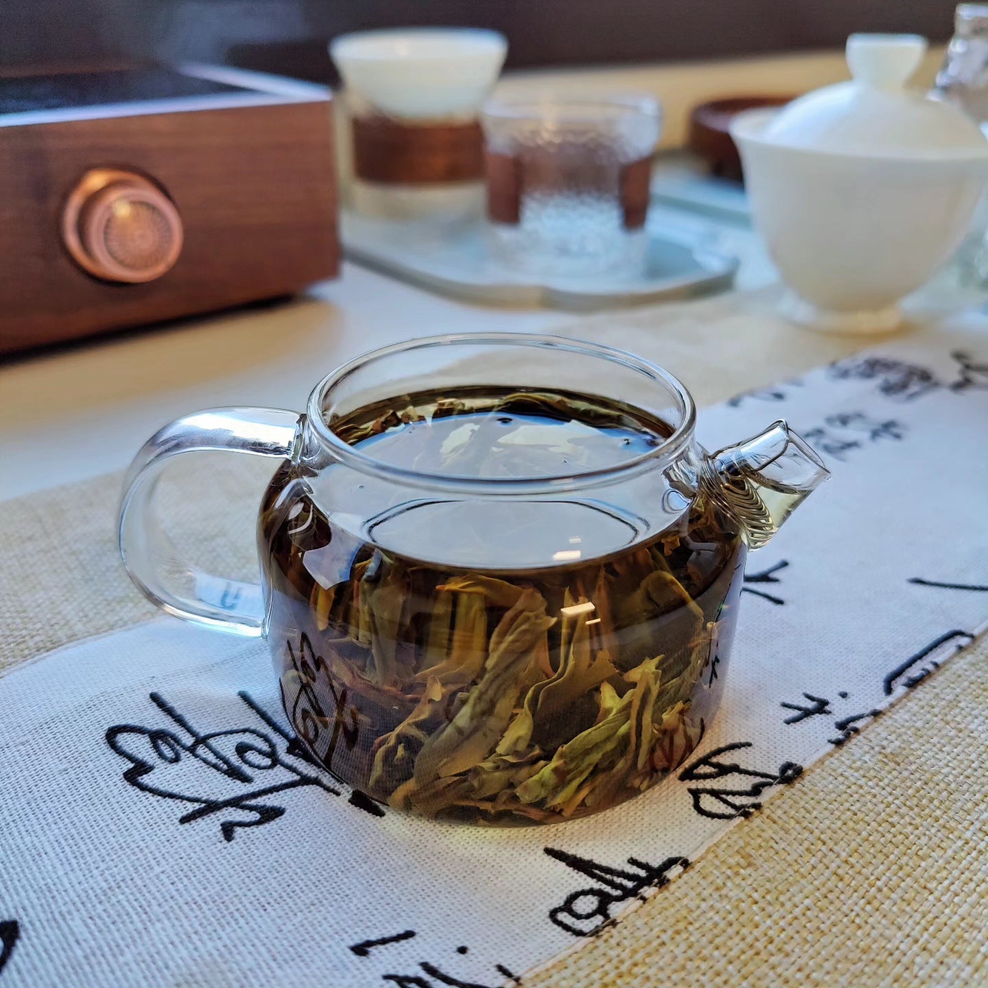 staring at tea leaves in glass teapot