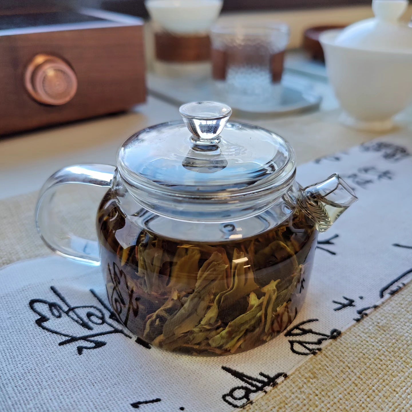 pu erh tea in glass teapot