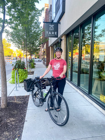 Female biking to shop