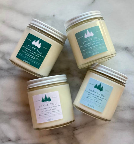 Personalized custom soy candles with labels for a wedding