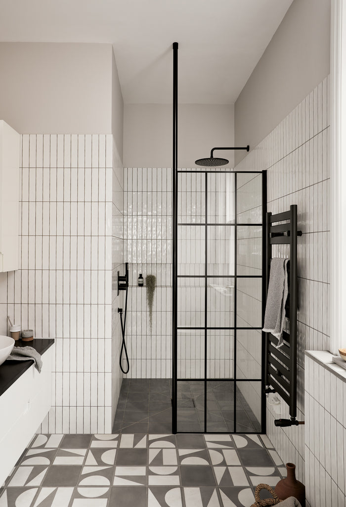 Skinn y White Metro tiles and Split Shift Limestone Grey tiles by Bert & May for small bathroom ideas