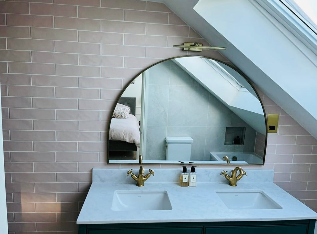 The new vanity is topped with an arched mirror - tiles by Hyperion Tiles