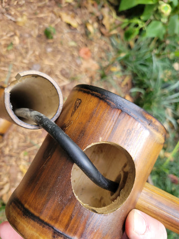 Put hose through fountain top, into fountain spout.