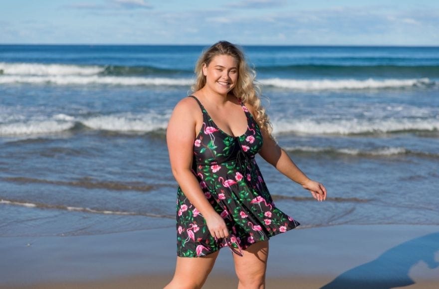 Woman wearing swim dress at the beach
