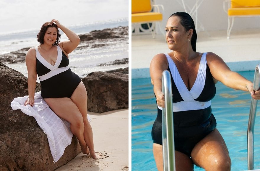 Woman with short brown hair wears black v neck one piece with white trim.