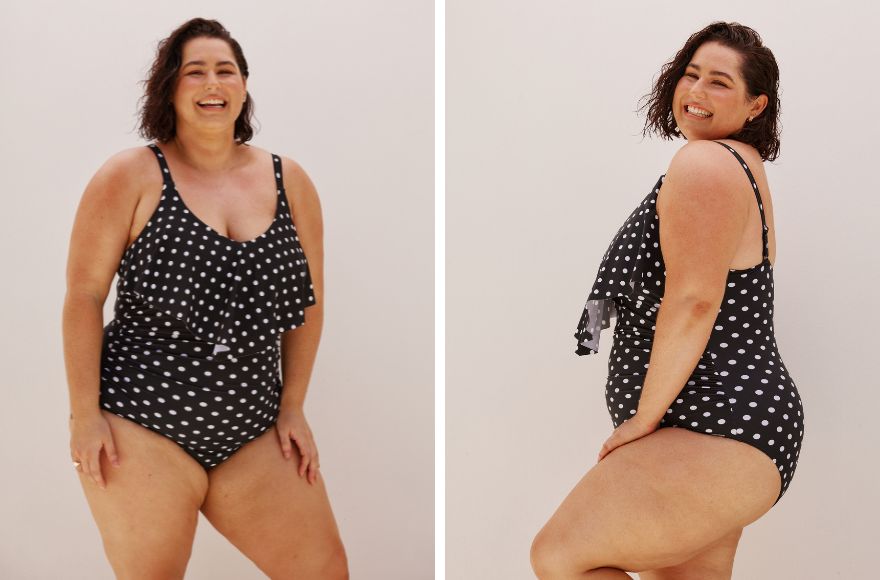 Woman with short brown hair wears Black and White Dots long frill one piece swimsuit