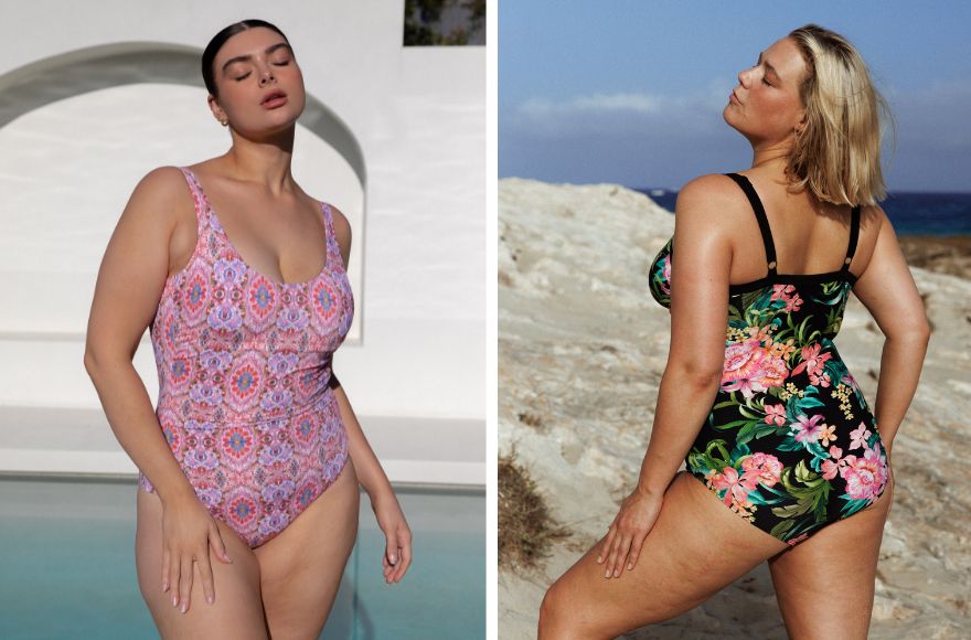 Woman with slicked back brown hair wears Amalfi Pink scoop one piece swimsuit. Blonde woman wears Bora Bora black and floral underwire one piece swimsuit