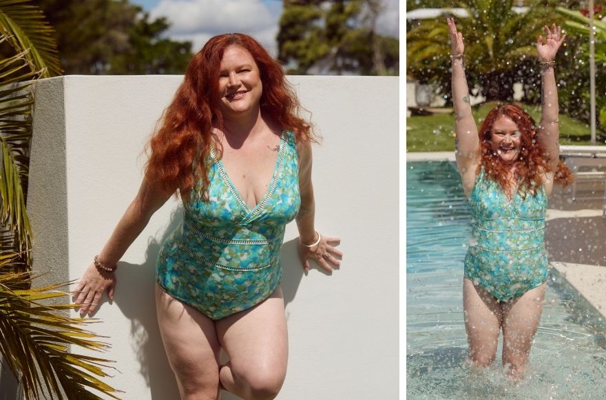 Woman with long red hair wears aqua blue swimsuit