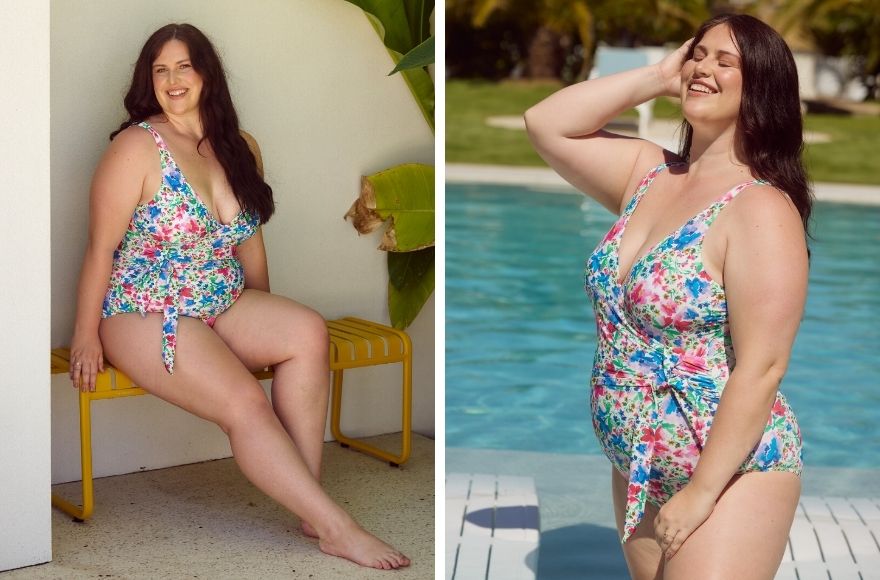 Woman with long brown hair wears bright floral one piece swimsuit