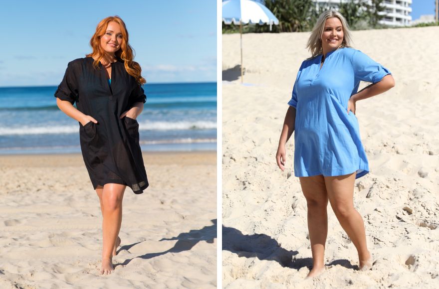 Woman with red hair wears black overshirt. Woman with blonde hair wears blue over shirt. 