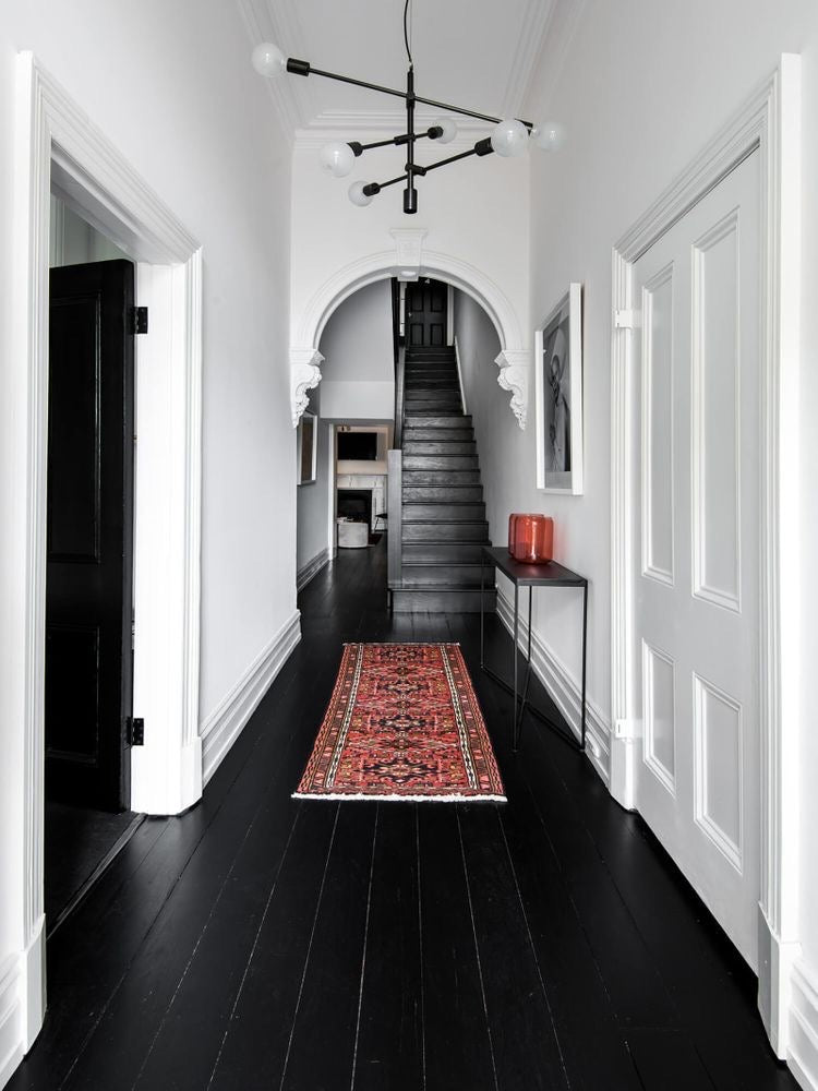 Black Wood floor in long hallway