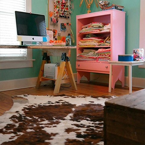 Pink Sewing Room with a cowhide rug