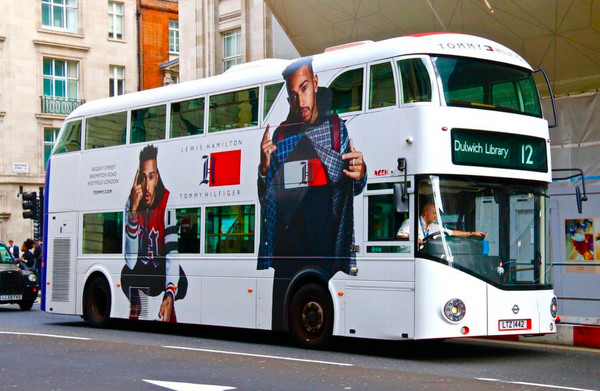 Out of home marketing example, fashion brand Tommy Hilfiger uses a double decker bus 