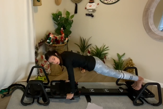 woman exercising on the Lagree Micro at home