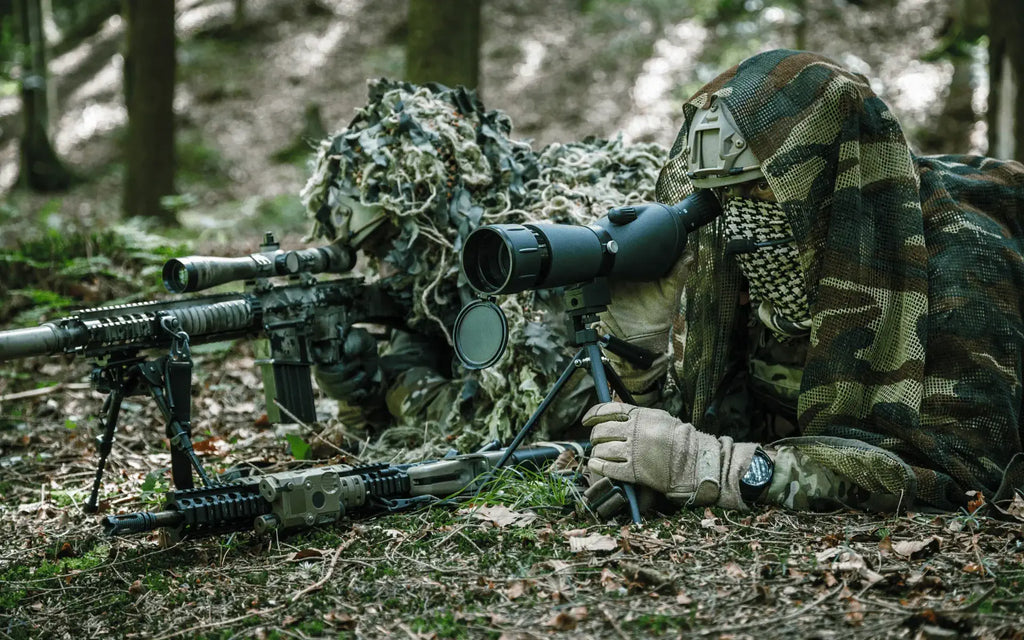 Two Airsoft players in ghillie camouflage gear