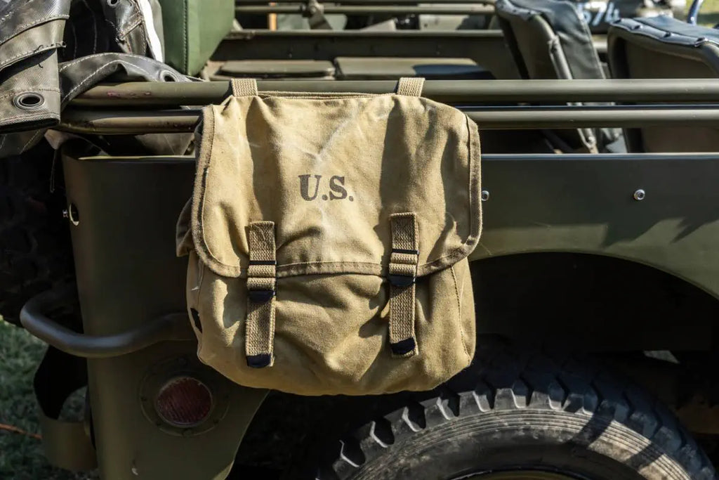 Military musette hanging from a truck