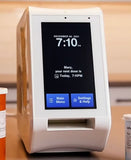 Spencer from Custom Health shown pictured on the table ready to dispense medications