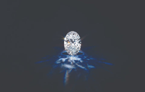 An oval cut lab-grown carbon diamond sitting on display sparkling just like a mined diamond debunking any myths about lab-grown diamonds and their appearance.