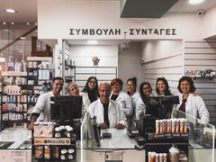 Staff photo with pharmacist Nikos Avgerinos at the Avgerinos Pharmacy
